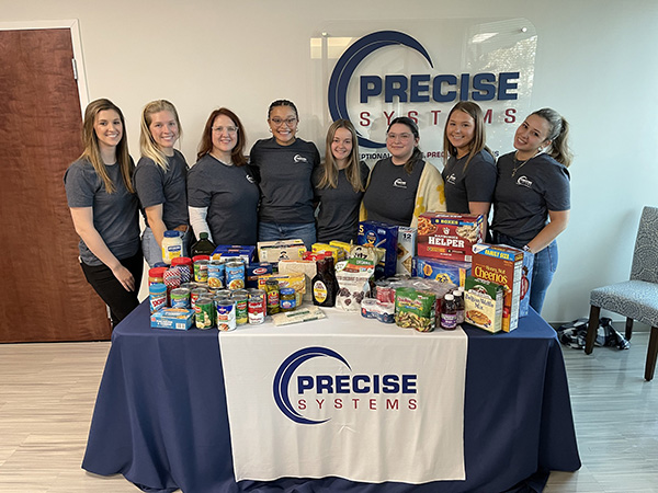 Employees participating in local food drive